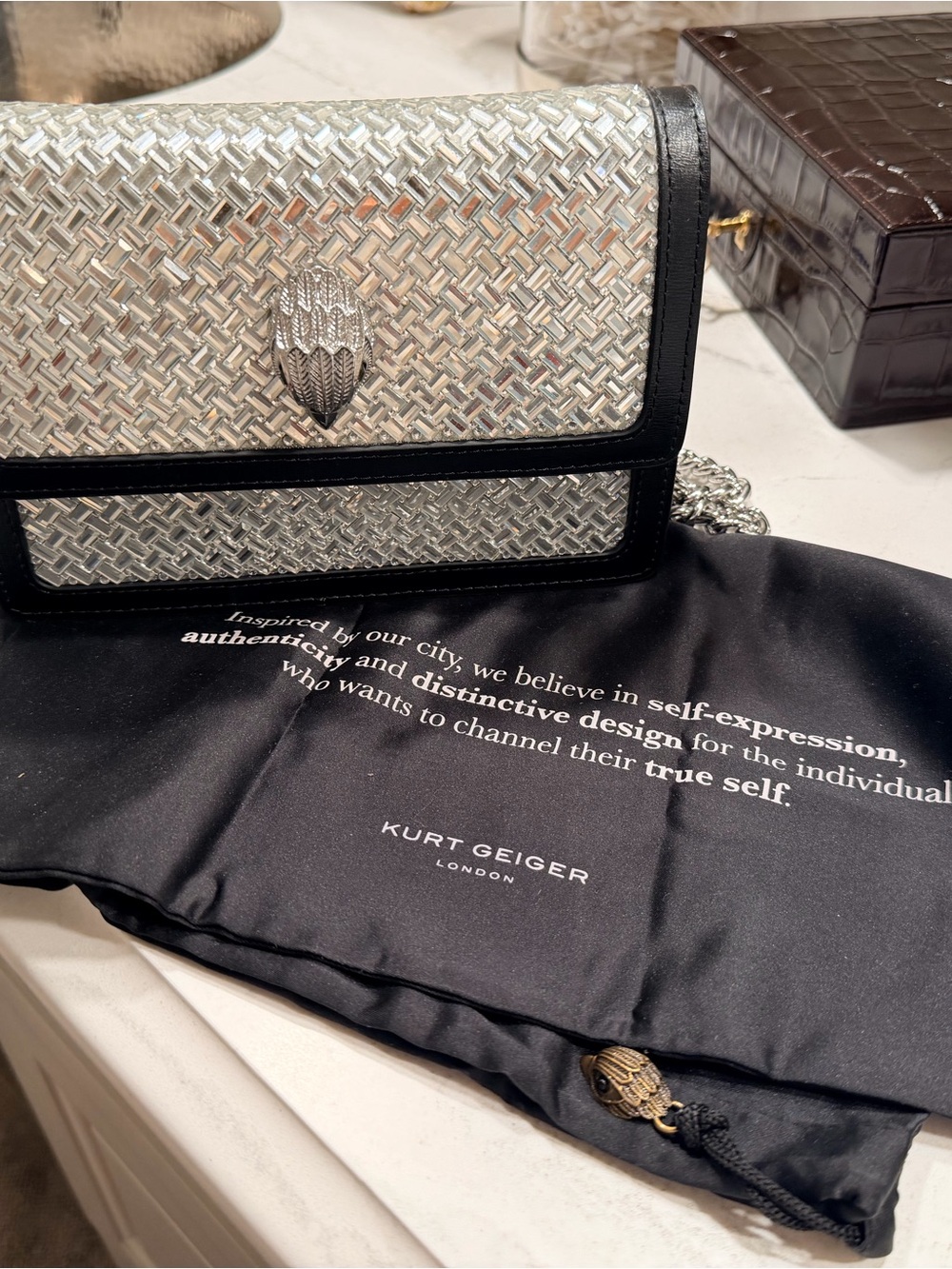Kurt Geiger Silver Mirror Woven Crossbody with Black Trim and Silver Chain Strap